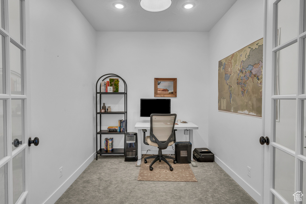 Carpeted home office featuring baseboards, recessed lighting, and french doors