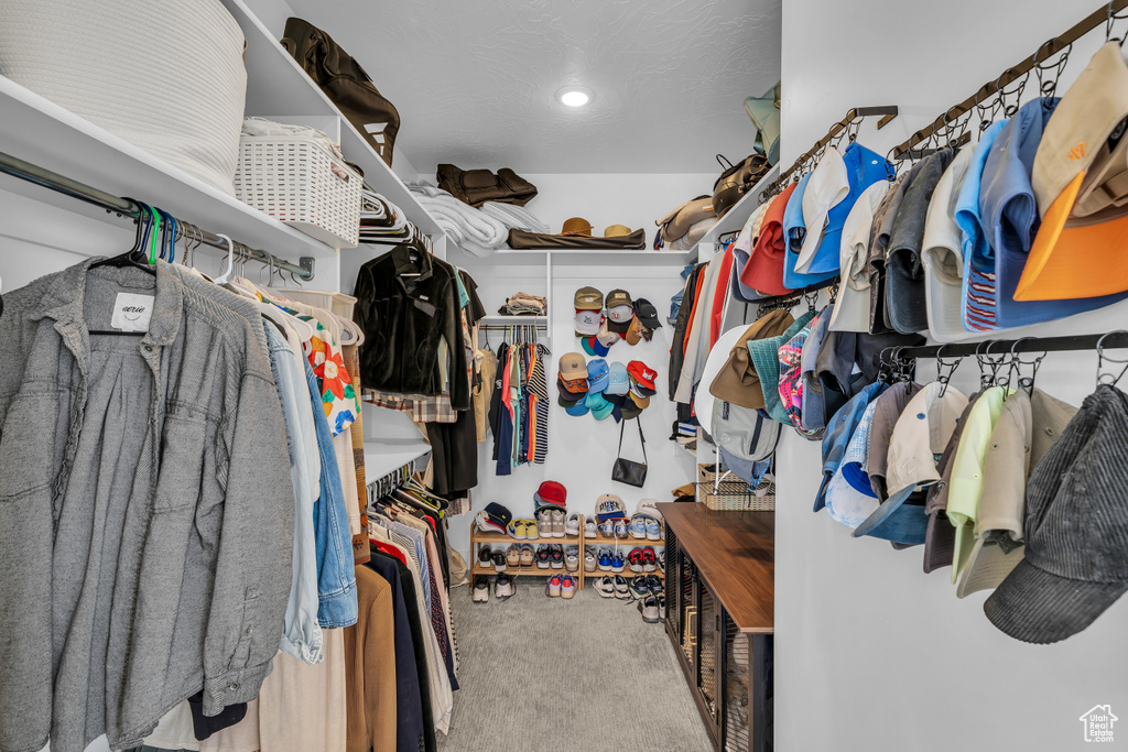 Walk in closet with carpet