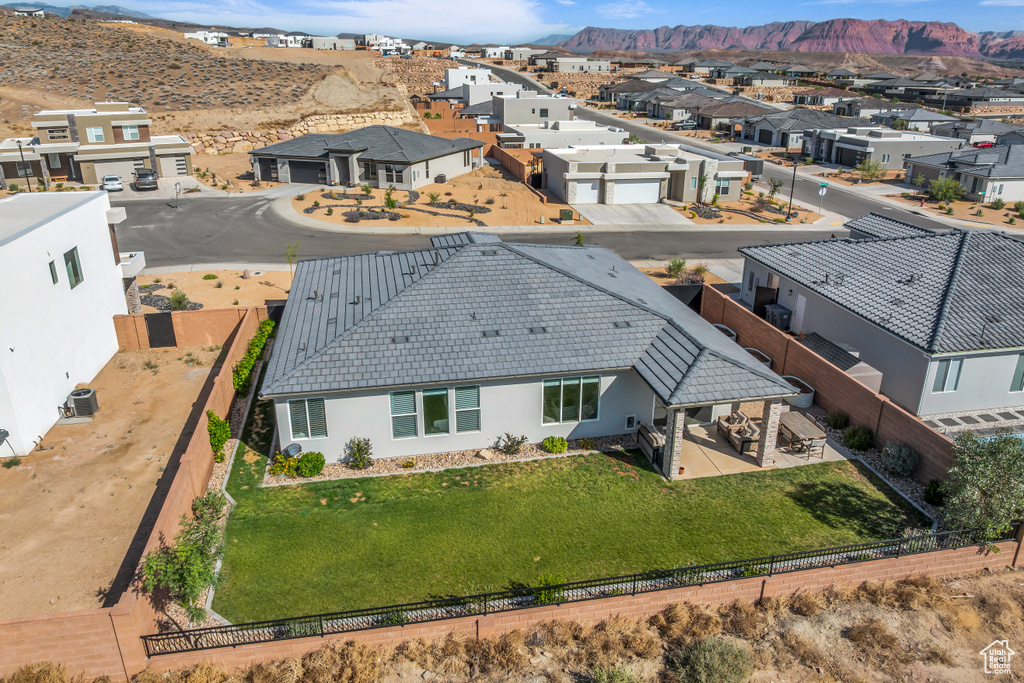 Aerial perspective of suburban area with a mountainous background