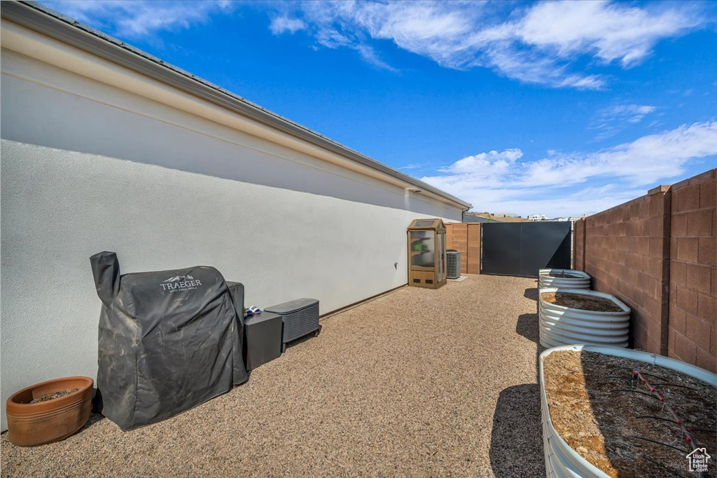 View of property exterior featuring a fenced backyard and stucco siding