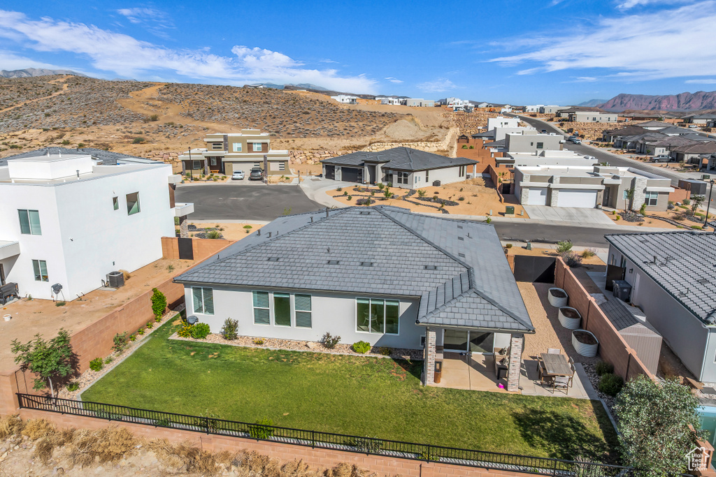 Aerial perspective of suburban area with a mountainous background
