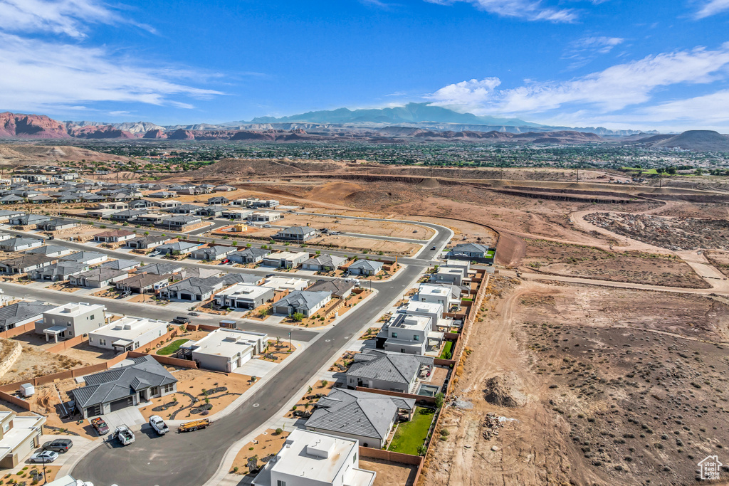 Aerial view of residential area featuring a mountain backdrop
