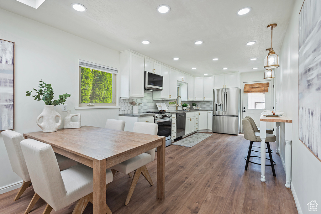 Dining room featuring recessed lighting and dark wood finished floors