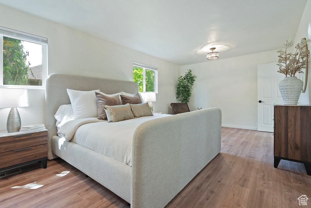 Bedroom featuring light wood-style flooring and baseboards