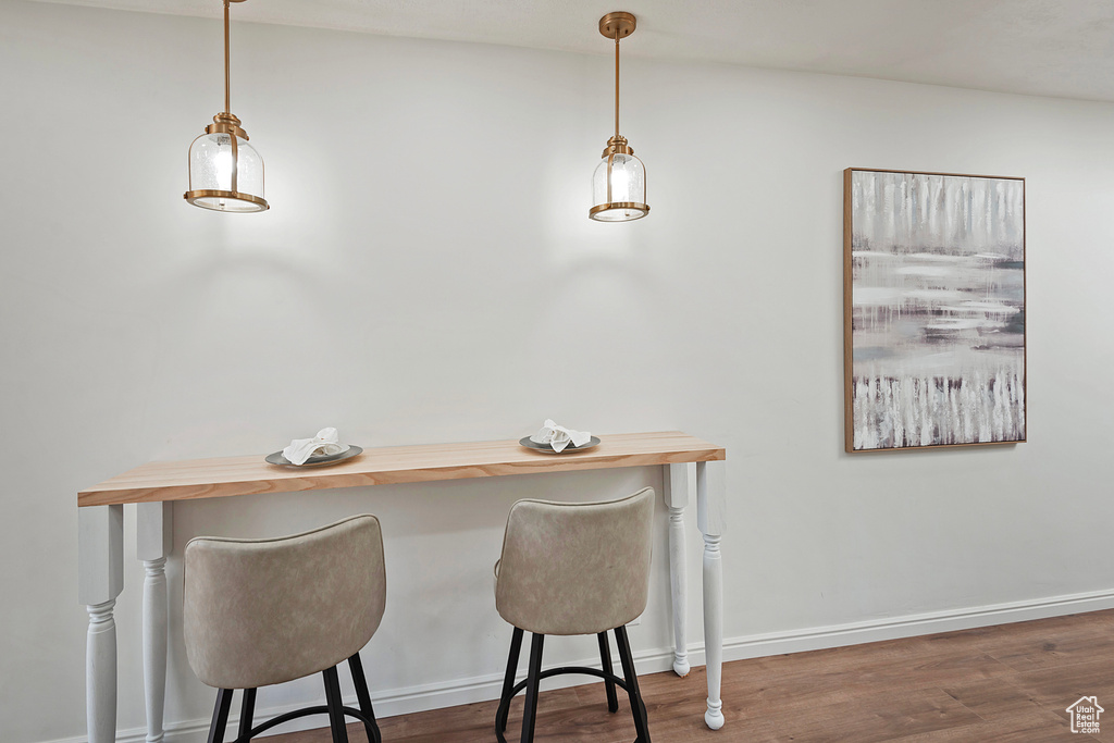 Dining area featuring wood finished floors and baseboards