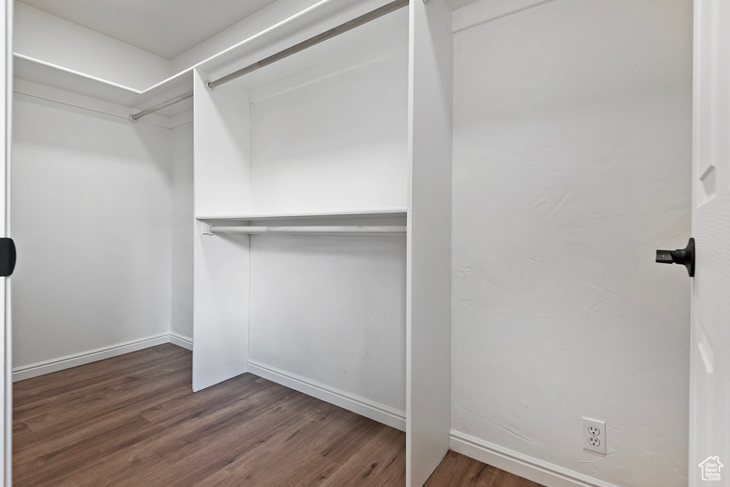 Walk in closet featuring wood finished floors