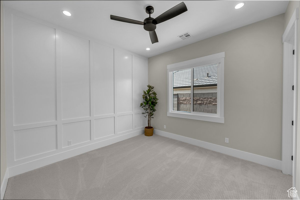 Unfurnished room with light colored carpet, ceiling fan, recessed lighting, and baseboards