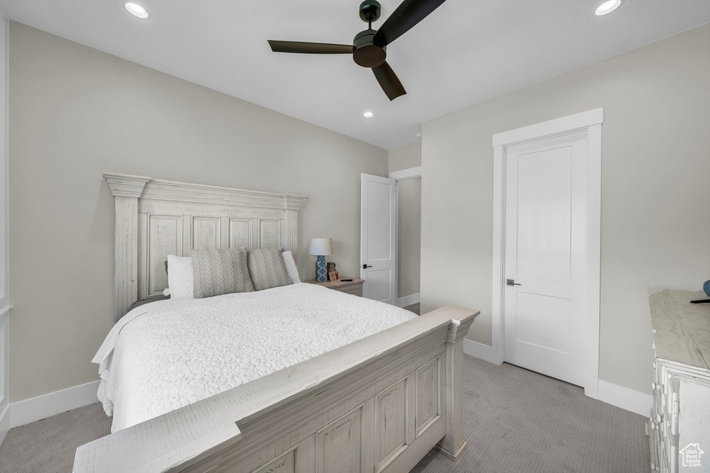Bedroom featuring light carpet, baseboards, recessed lighting, and a ceiling fan