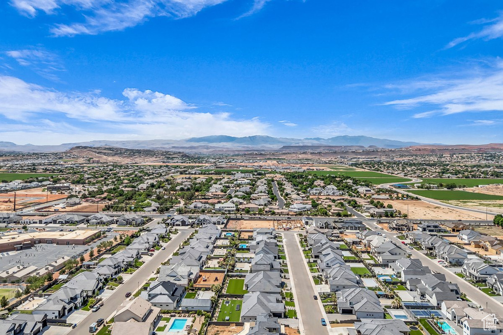 Aerial view of residential area featuring a mountain backdrop