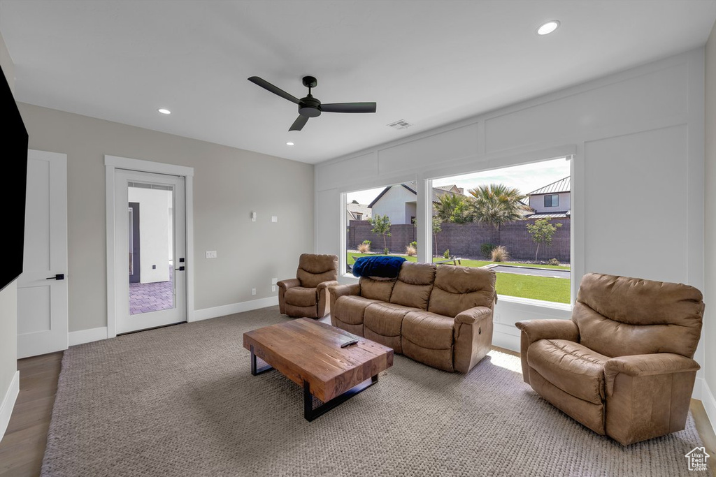 Living room featuring ceiling fan, recessed lighting, baseboards, and wood finished floors