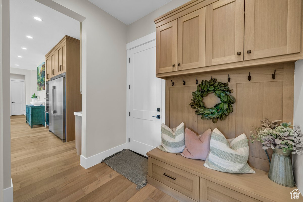 Mudroom with light wood-style floors, baseboards, and recessed lighting