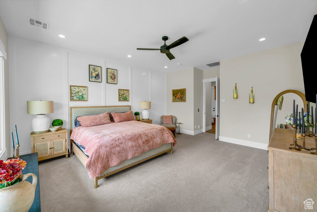 Bedroom featuring light colored carpet, recessed lighting, baseboards, and ceiling fan
