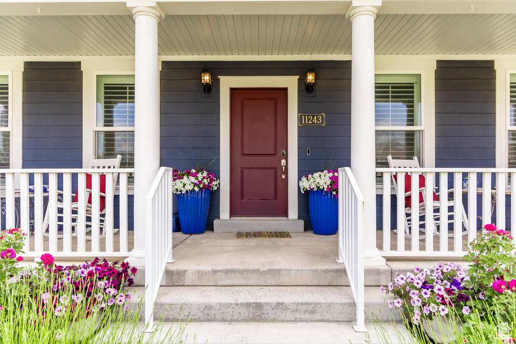 Property entrance with covered porch