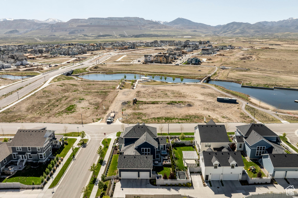 Aerial view of residential area featuring a water and mountain view