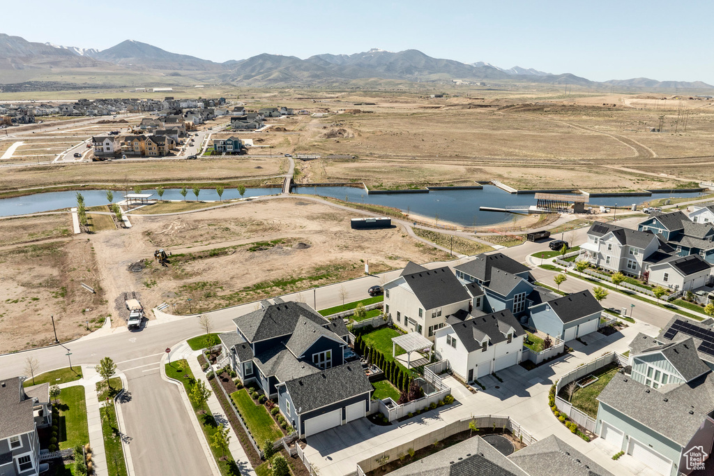View of property location with a water and mountain view and nearby suburban area