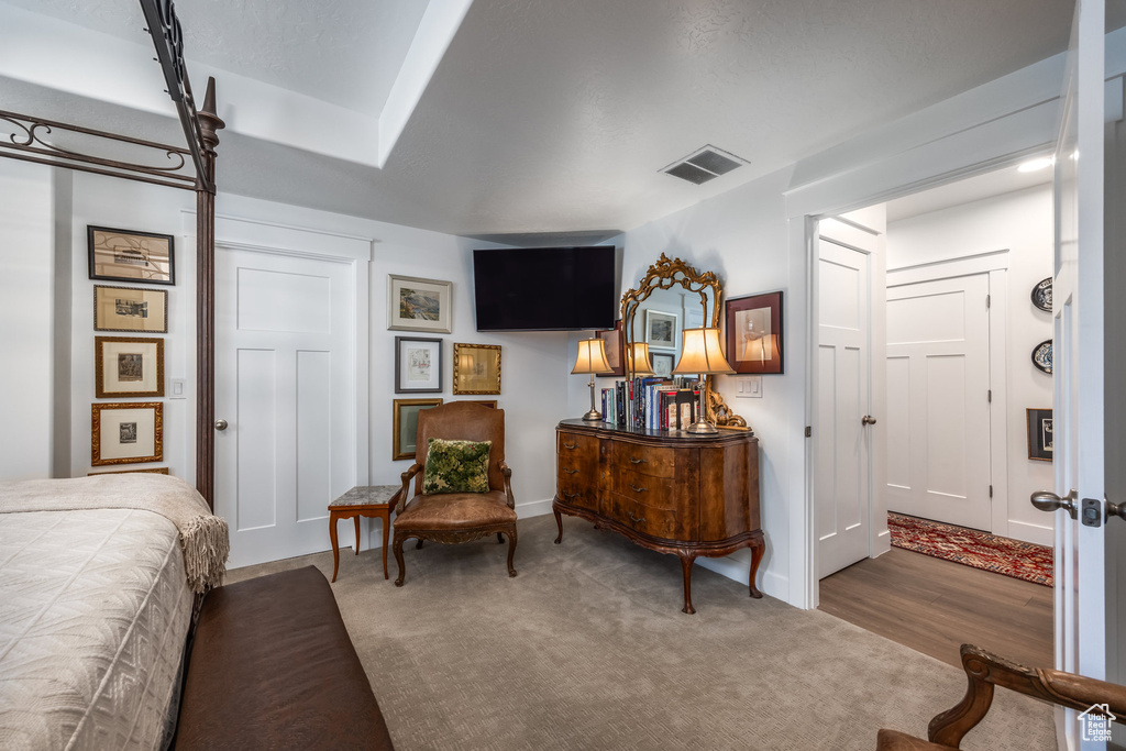 Carpeted bedroom featuring baseboards