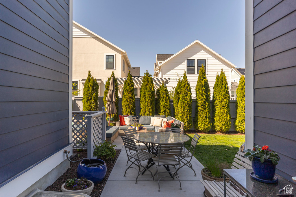 View of patio / terrace featuring outdoor lounge area, outdoor dining area, and fence