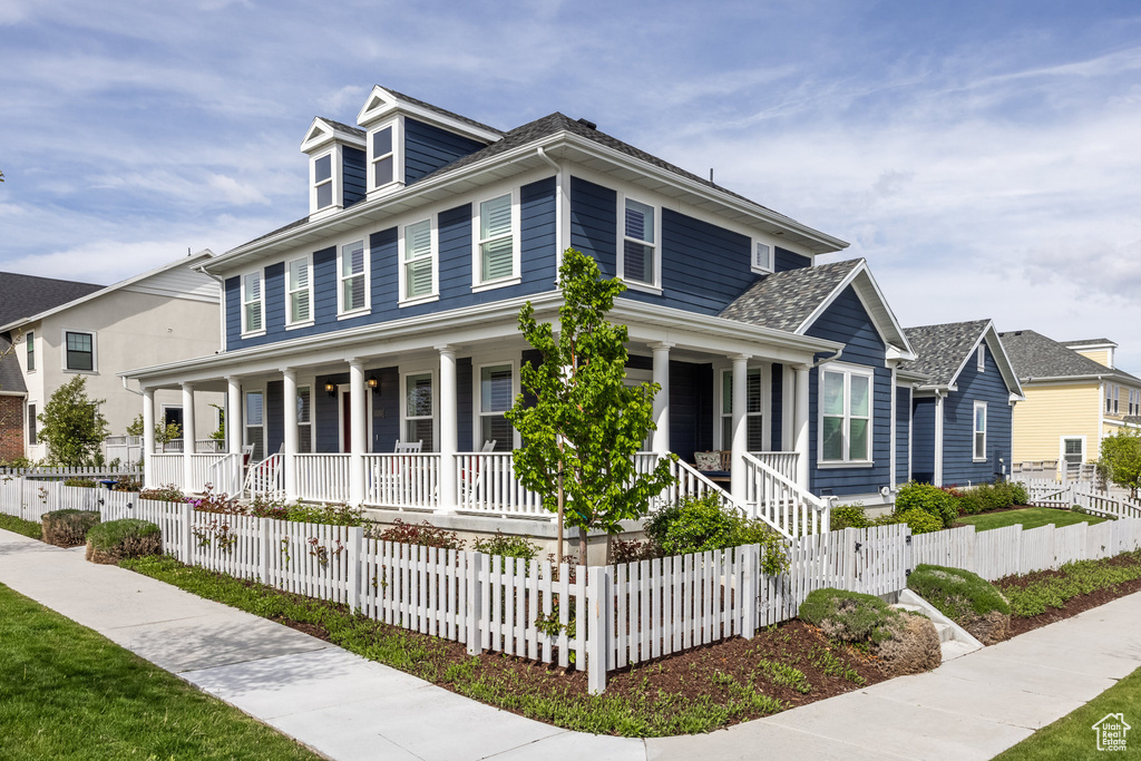 Farmhouse inspired home featuring covered porch