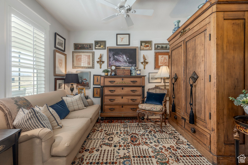 Living room featuring a ceiling fan