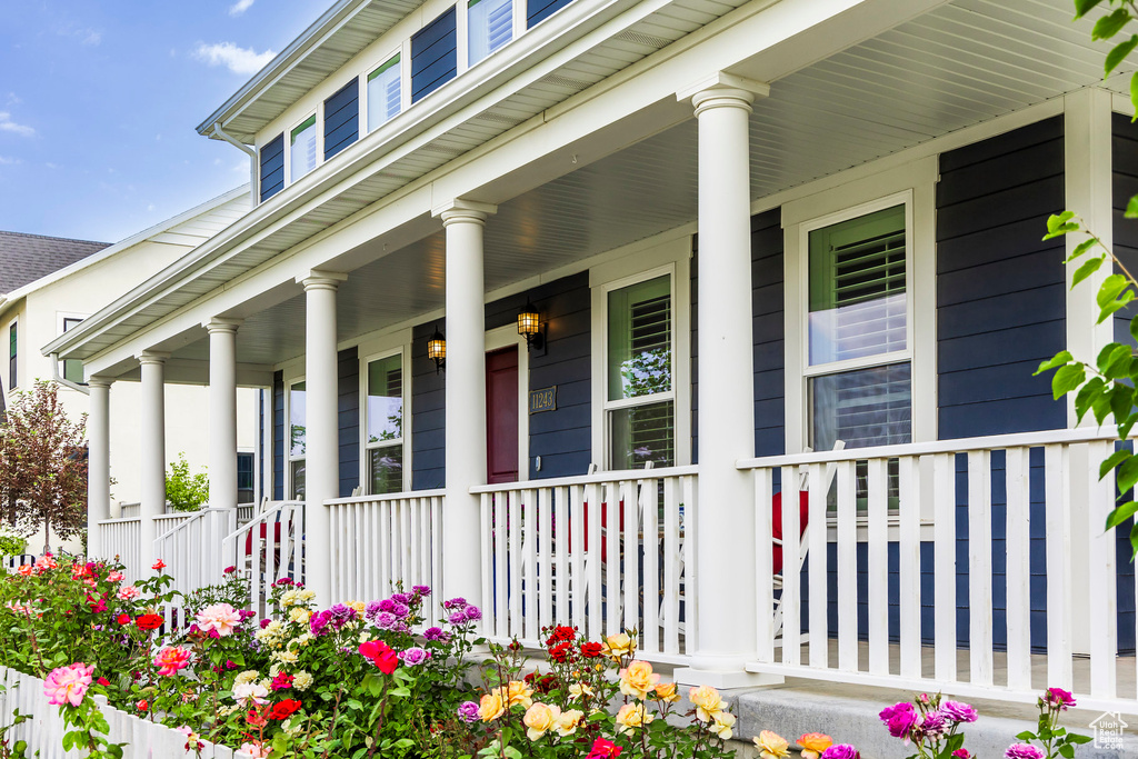 Entrance to property featuring a porch