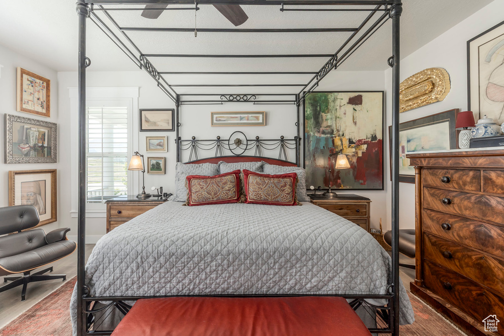 Bedroom with wood finished floors and ceiling fan