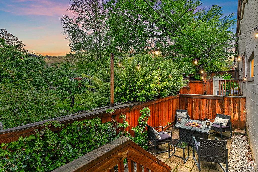Deck at dusk with a fire pit