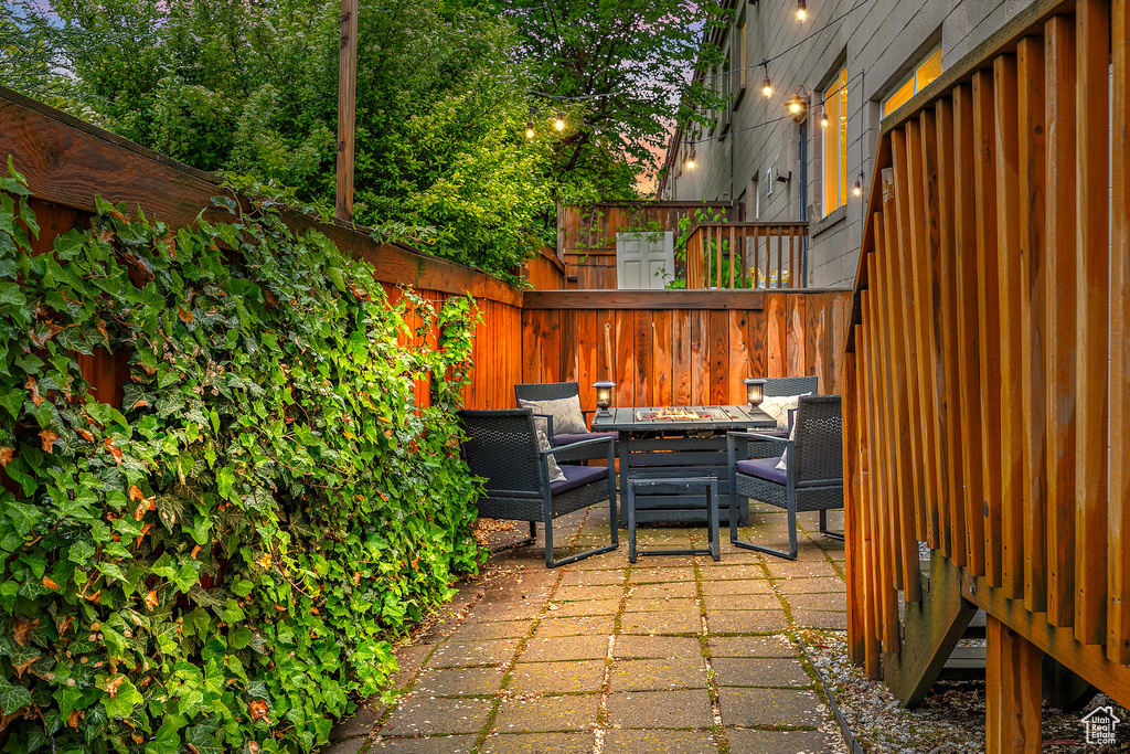 View of patio / terrace featuring a fire pit and fence
