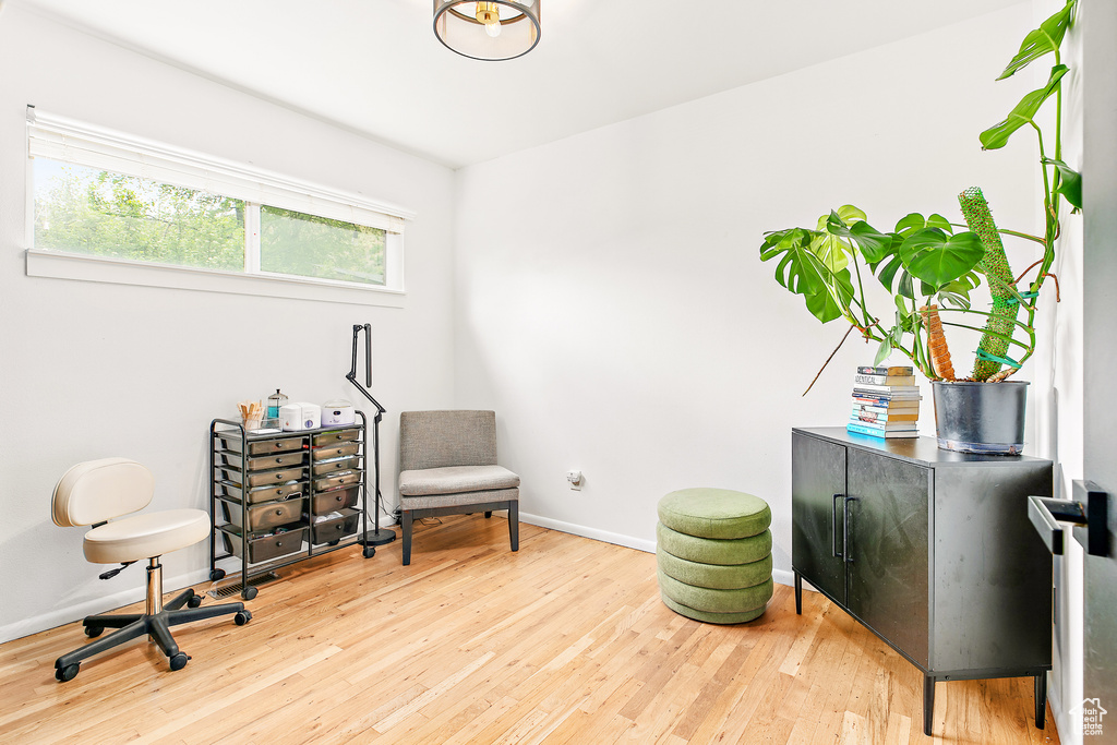 Sitting room featuring wood finished floors and baseboards