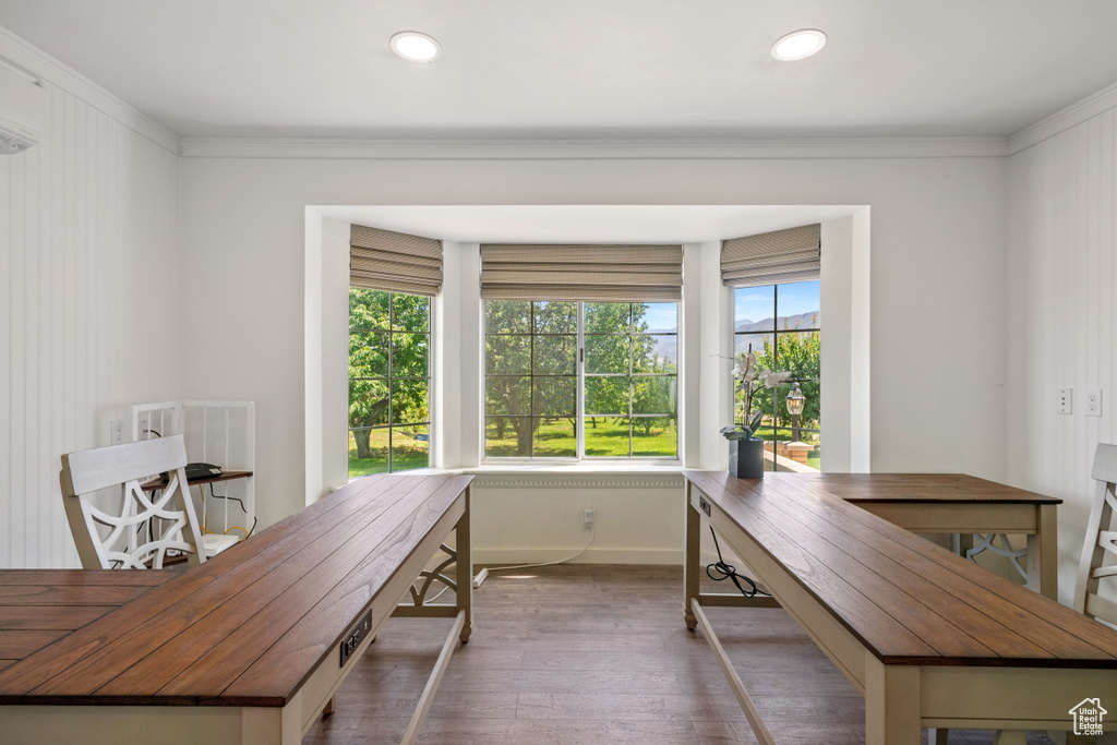 Office space featuring crown molding, recessed lighting, baseboards, and hardwood / wood-style floors