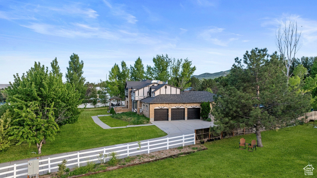 View of home's exterior featuring a garage and concrete driveway