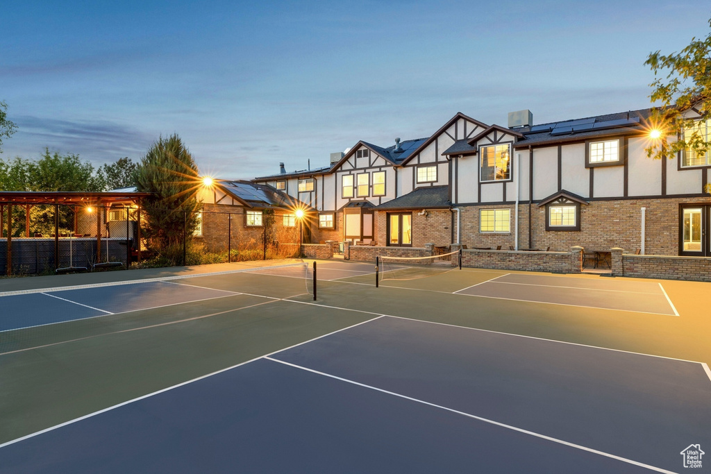 View of tennis court featuring basketball court