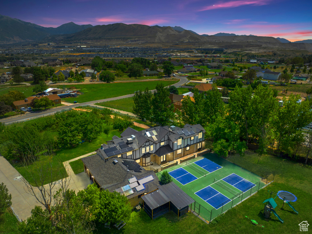 Aerial view at dusk featuring a mountain view