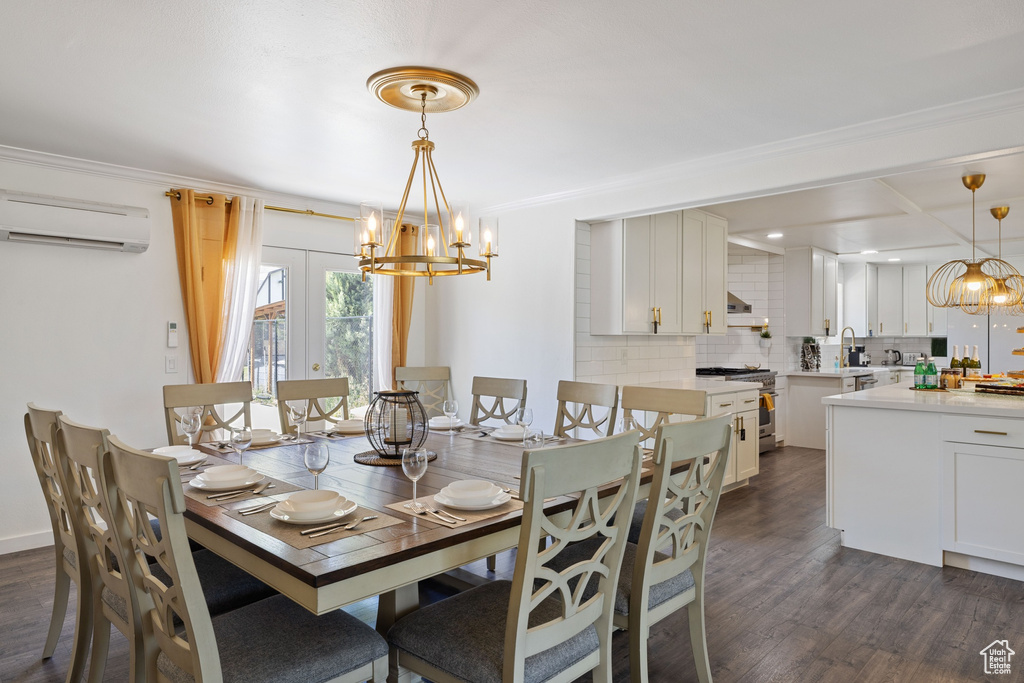Dining space with a wall mounted AC, dark wood-type flooring, a chandelier, and ornamental molding