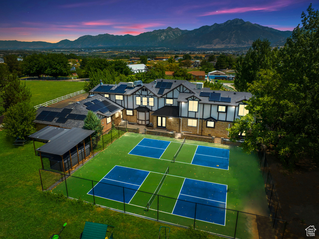 Birds eye view of property with a mountain view