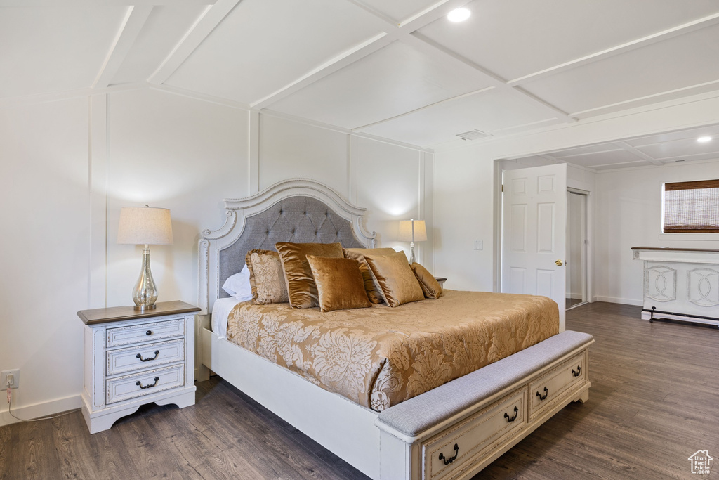 Bedroom featuring baseboards, dark wood-style floors, coffered ceiling, and recessed lighting