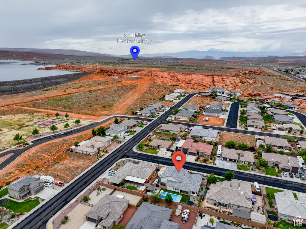 View of property location featuring nearby suburban area and a water and mountain view