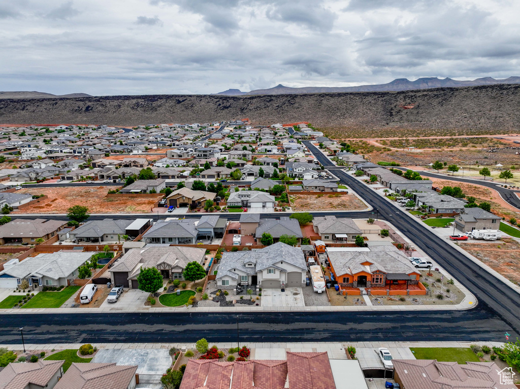 Aerial view of residential area featuring a mountainous background