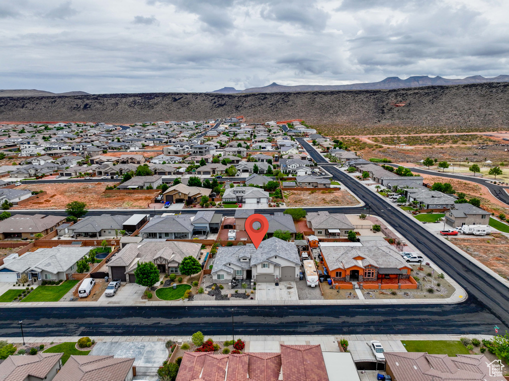 Aerial perspective of suburban area featuring a mountain backdrop