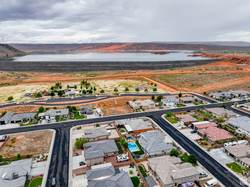 Aerial perspective of suburban area with a nearby body of water