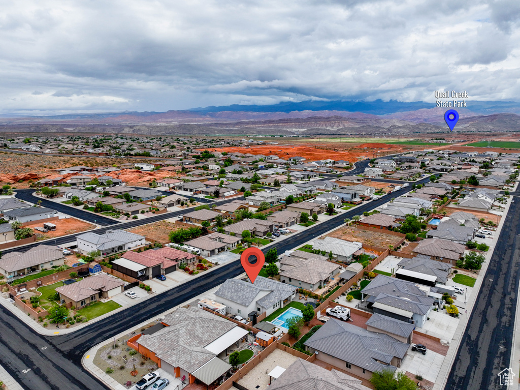 Aerial view of residential area featuring mountains