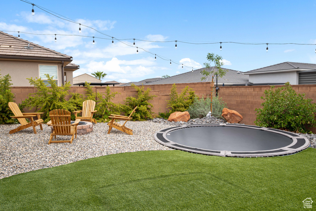 View of yard featuring a trampoline