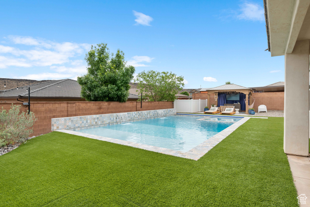 View of pool featuring a gazebo, an outdoor living space, and a patio area