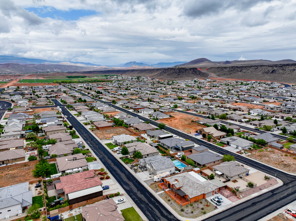 Aerial perspective of suburban area featuring a mountain backdrop