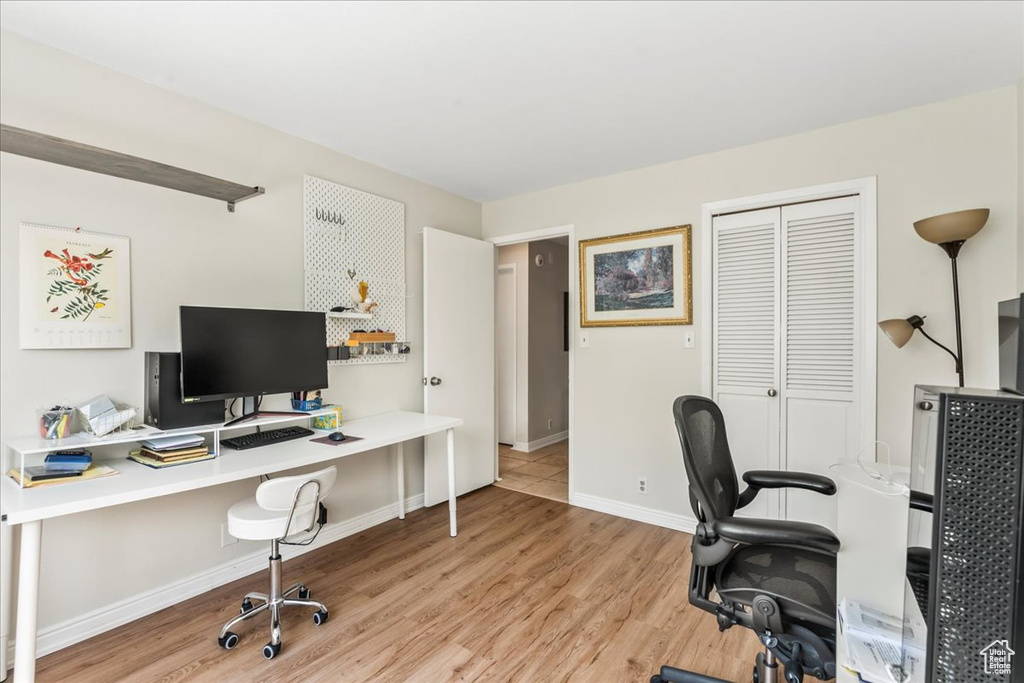Office space with wood finished floors and baseboards