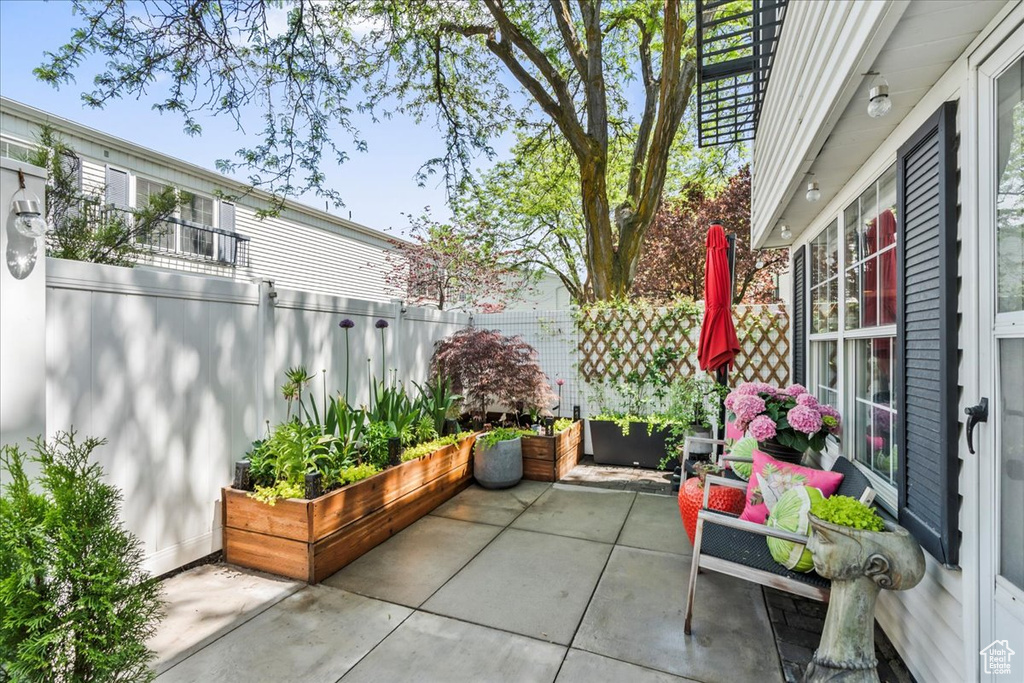 View of patio / terrace featuring fence