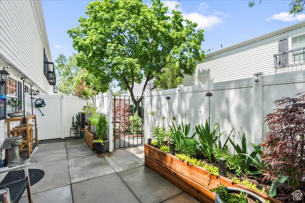 View of patio with a fenced backyard