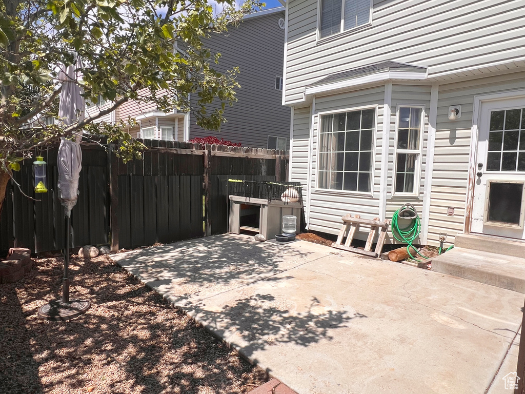 View of patio / terrace featuring fence and entry steps