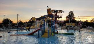 View of playground featuring a water view