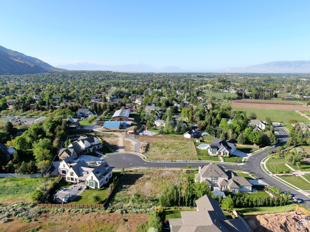 Aerial view of residential area with a mountainous background