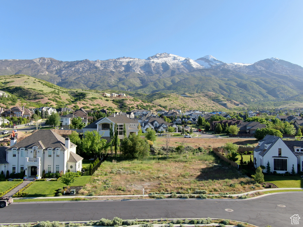 View of mountain backdrop featuring nearby suburban area